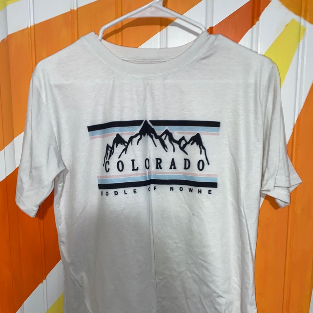 White tee shirt with a picture on the front